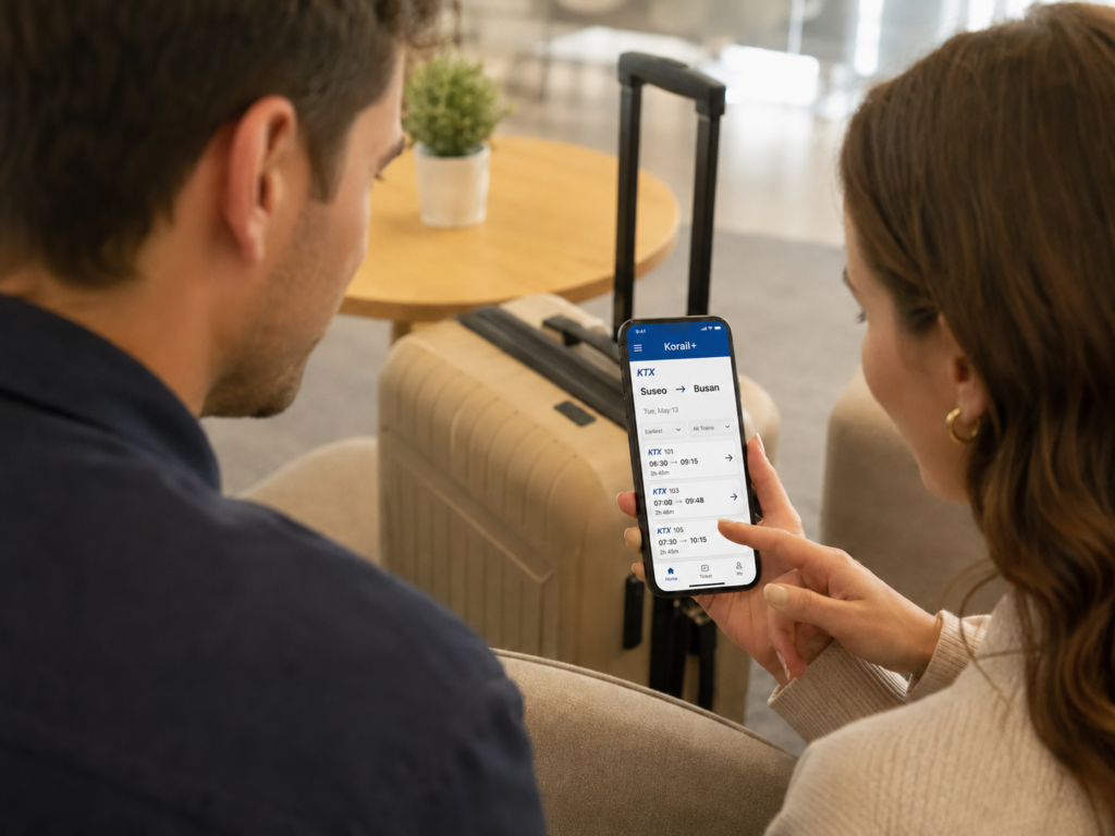 Foreign travelers searching for a KTX from Suseo to Busan using the Korail+ app