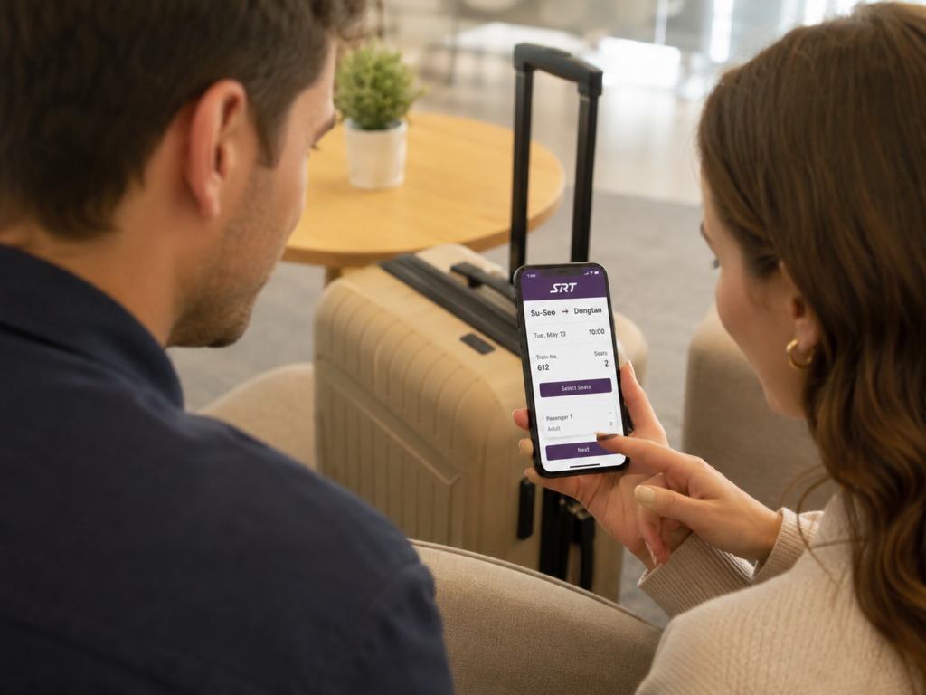 Foreign travelers checking SRT train schedules and seat options on a smartphone app.